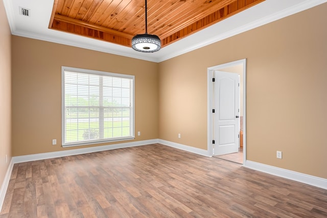 2045 Holland Rd, Newton, AL 36352 - unfurnished room with a tray ceiling, baseboards, wood finished floors, wooden ceiling, and crown molding