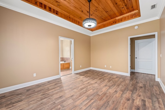 2045 Holland Rd, Newton, AL 36352 - empty room featuring a raised ceiling, wooden ceiling, baseboards, wood finished floors, and crown molding