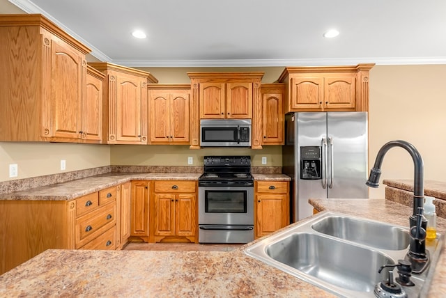 2045 Holland Rd, Newton, AL 36352 - kitchen with appliances with stainless steel finishes, a sink, ornamental molding, light countertops, and recessed lighting