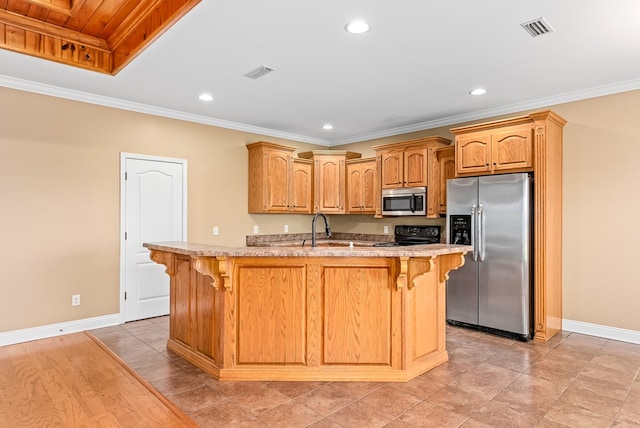 2045 Holland Rd, Newton, AL 36352 - kitchen with appliances with stainless steel finishes, baseboards, a kitchen bar, ornamental molding, and recessed lighting