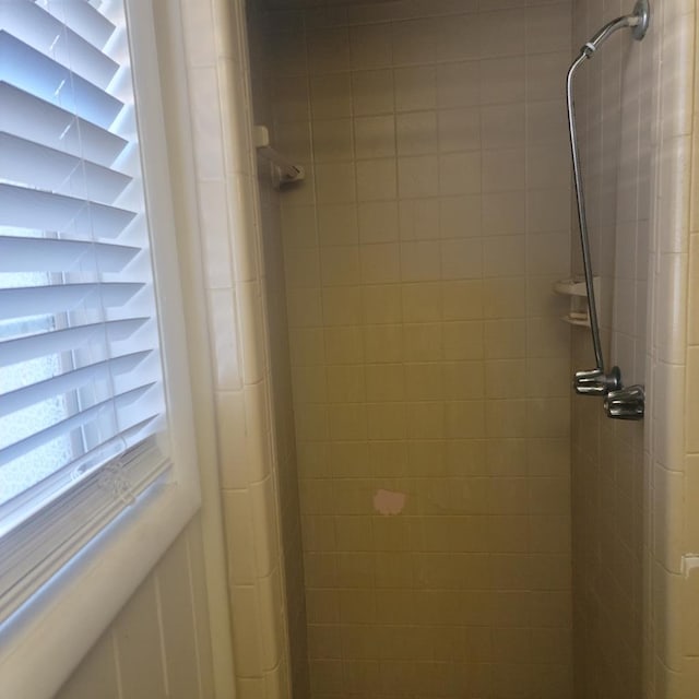 bathroom with a tile shower