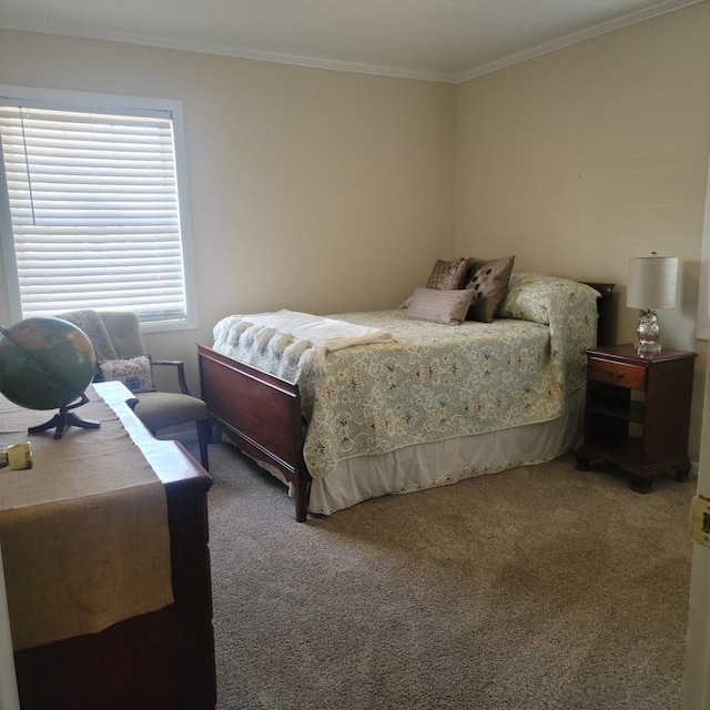 bedroom with crown molding and carpet