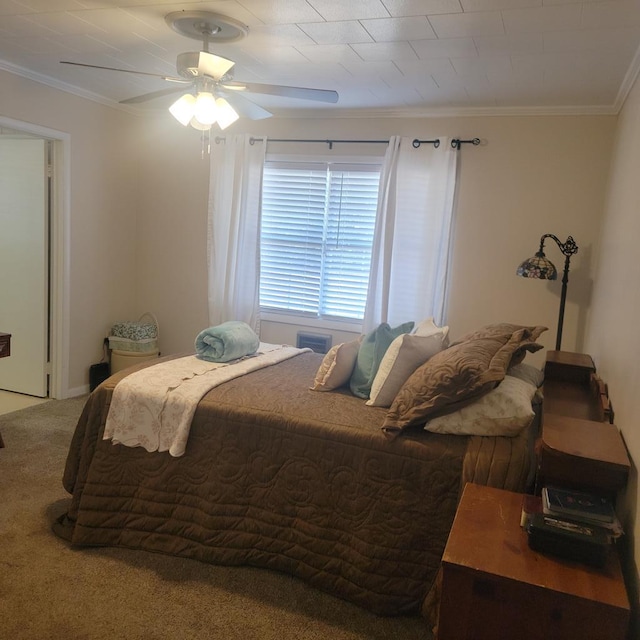 bedroom with a ceiling fan, carpet, and ornamental molding