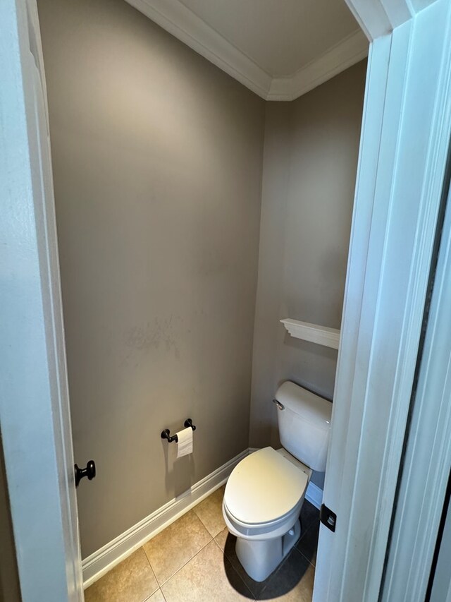 2103 Holland Rd, Newton, AL 36352 - bathroom featuring ornamental molding, toilet, baseboards, and tile patterned floors