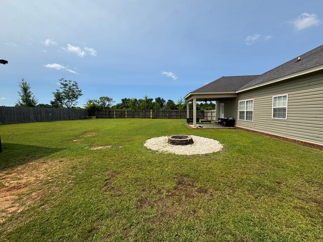 2103 Holland Rd, Newton, AL 36352 - view of yard featuring a fire pit and a patio area