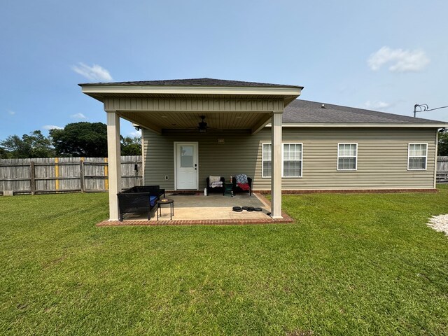 2103 Holland Rd, Newton, AL 36352 - rear view of house featuring ceiling fan, a patio, and roof with shingles
