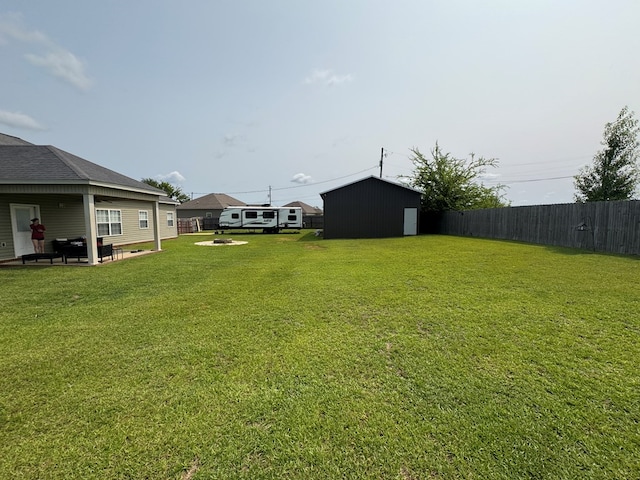 2103 Holland Rd, Newton, AL 36352 - view of yard with a patio, an outdoor fire pit, and an outbuilding