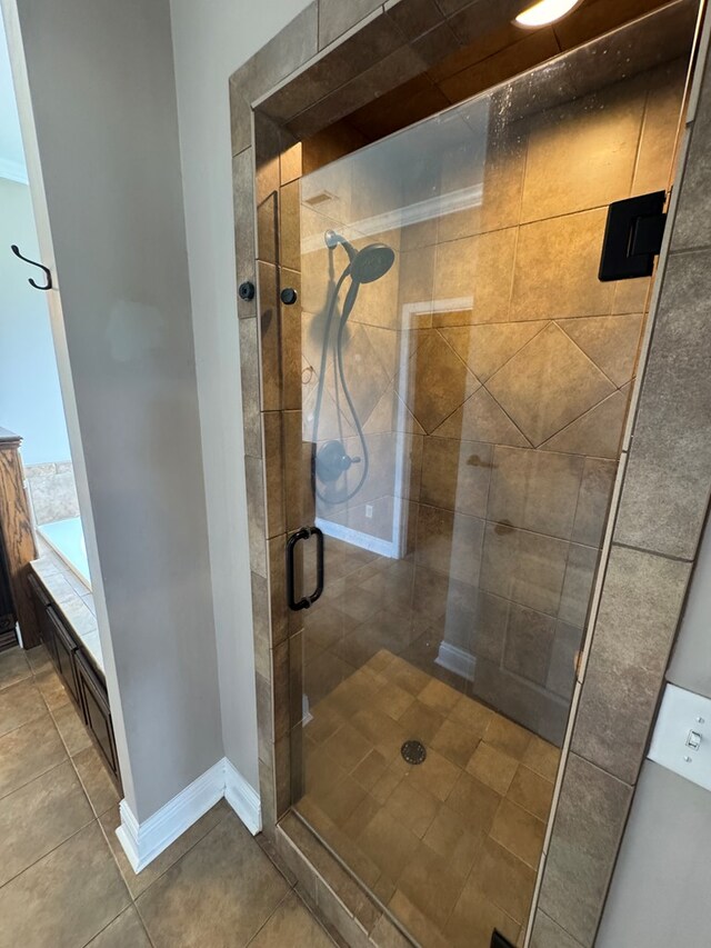 2103 Holland Rd, Newton, AL 36352 - bathroom with a stall shower, tile patterned flooring, and baseboards