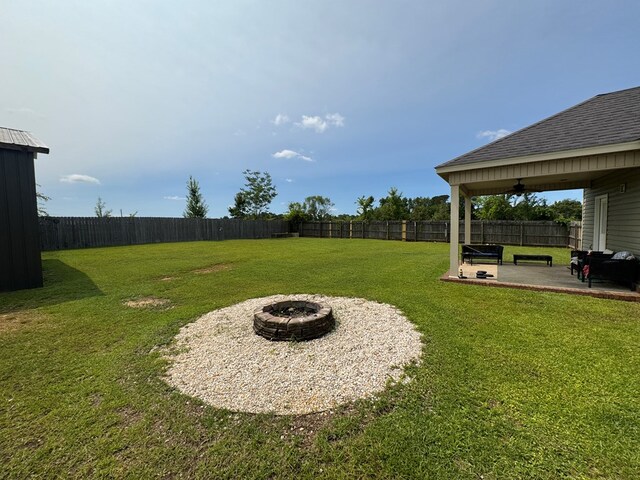 2103 Holland Rd, Newton, AL 36352 - view of yard with a patio, a fire pit, and a ceiling fan
