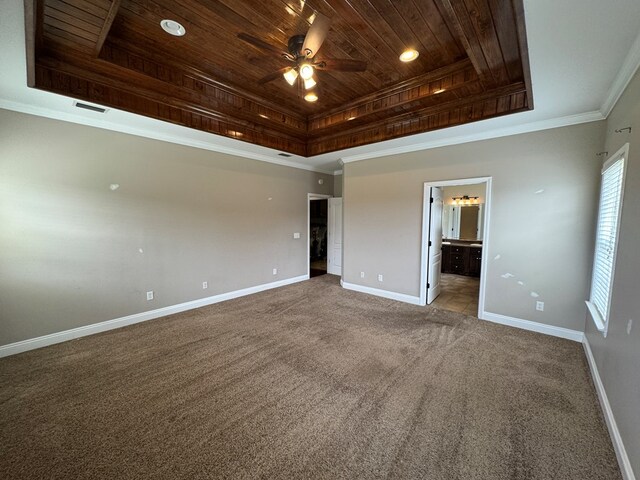 2103 Holland Rd, Newton, AL 36352 - unfurnished bedroom with wooden ceiling, a tray ceiling, carpet, baseboards, and crown molding