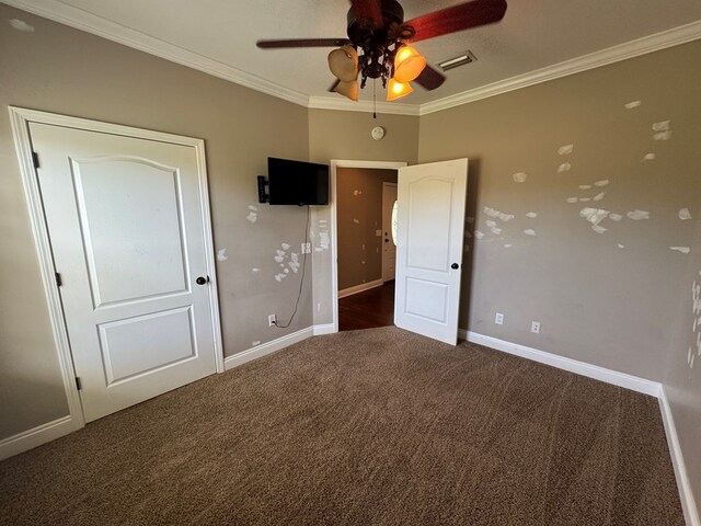 2103 Holland Rd, Newton, AL 36352 - unfurnished bedroom with carpet, crown molding, baseboards, and a ceiling fan