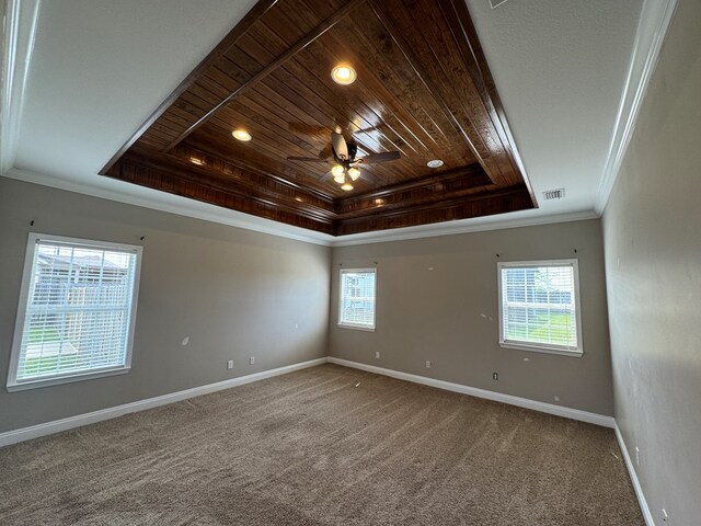 2103 Holland Rd, Newton, AL 36352 - empty room with a raised ceiling, wood ceiling, baseboards, ceiling fan, and carpet flooring