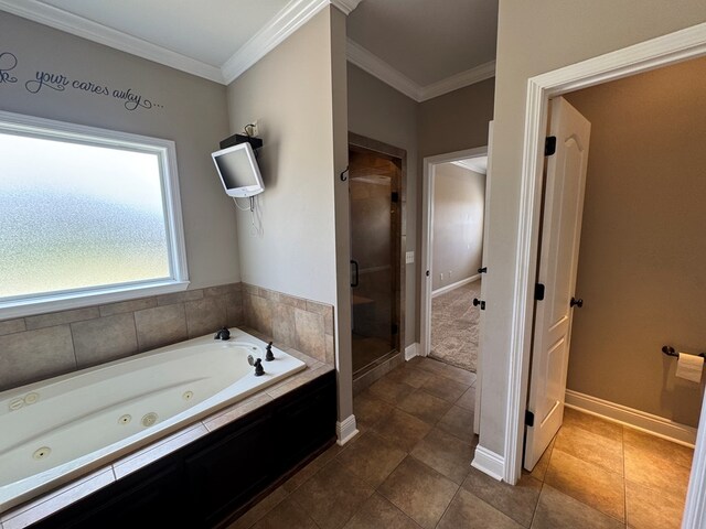 2103 Holland Rd, Newton, AL 36352 - full bath with a shower stall, a tub with jets, ornamental molding, baseboards, and tile patterned flooring
