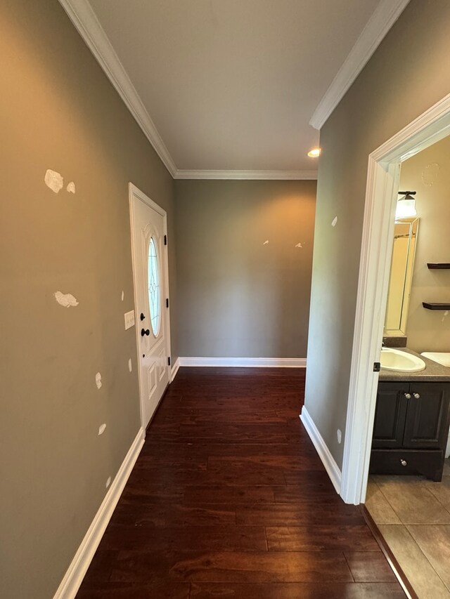 2103 Holland Rd, Newton, AL 36352 - hall featuring ornamental molding, wood finished floors, baseboards, and a sink