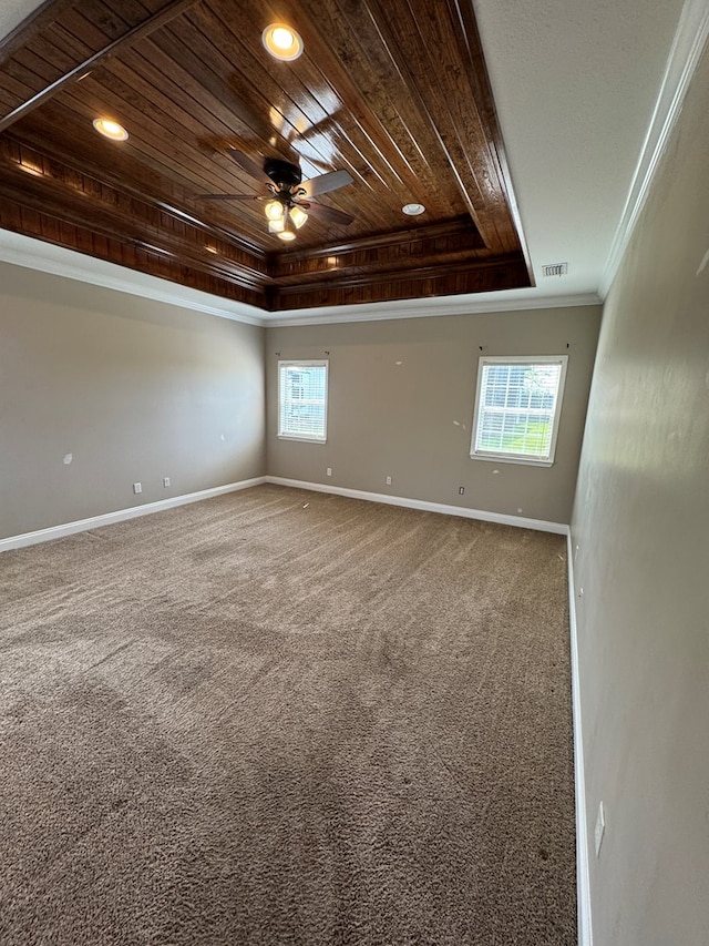2103 Holland Rd, Newton, AL 36352 - unfurnished room with a tray ceiling, wooden ceiling, crown molding, healthy amount of natural light, and baseboards