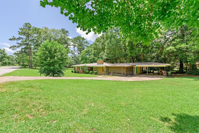 view of yard with a carport