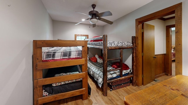 bedroom with ceiling fan and light hardwood / wood-style flooring