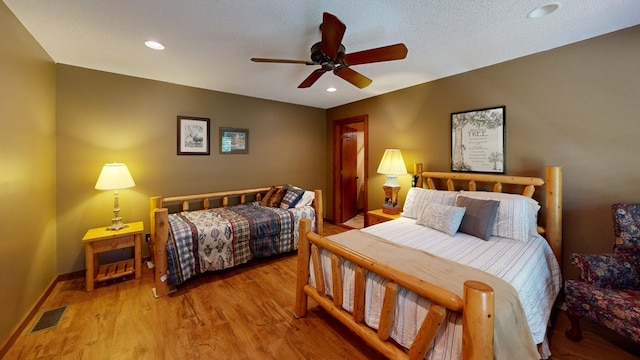 bedroom featuring ceiling fan and light wood-type flooring