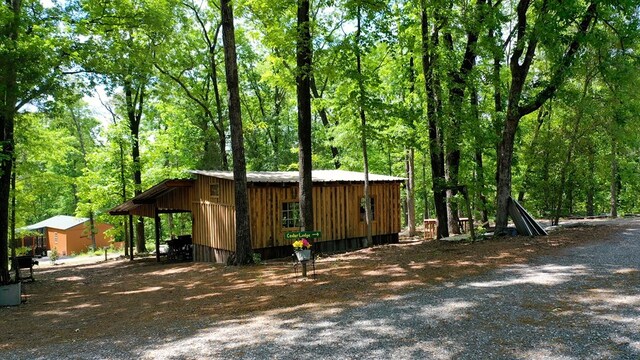 view of property exterior featuring a carport