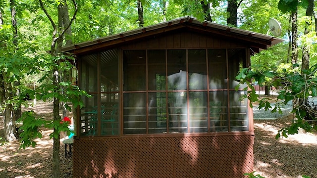 view of outdoor structure featuring a sunroom