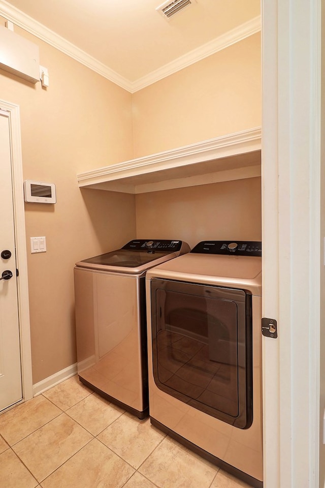 223 Veritas Dr, Dothan, AL 36303 - washroom featuring washing machine and clothes dryer, crown molding, and light tile patterned flooring