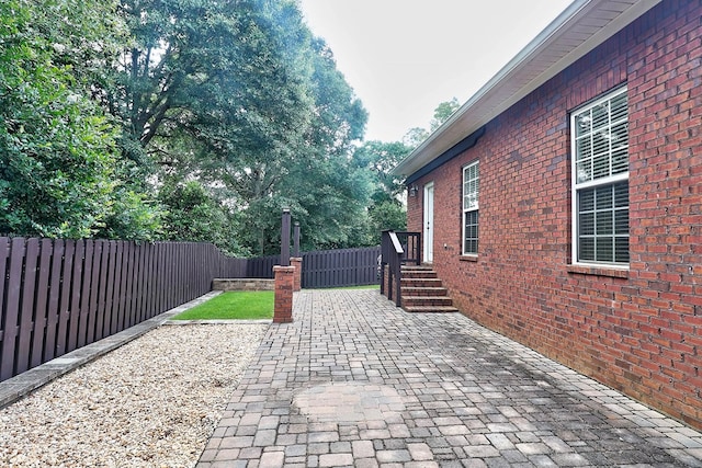 223 Veritas Dr, Dothan, AL 36303 - fenced backyard with a patio area