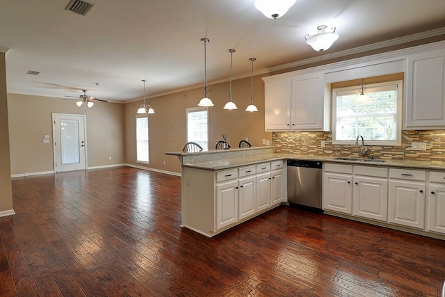 223 Veritas Dr, Dothan, AL 36303 - kitchen with dishwasher, a peninsula, crown molding, decorative backsplash, and ceiling fan