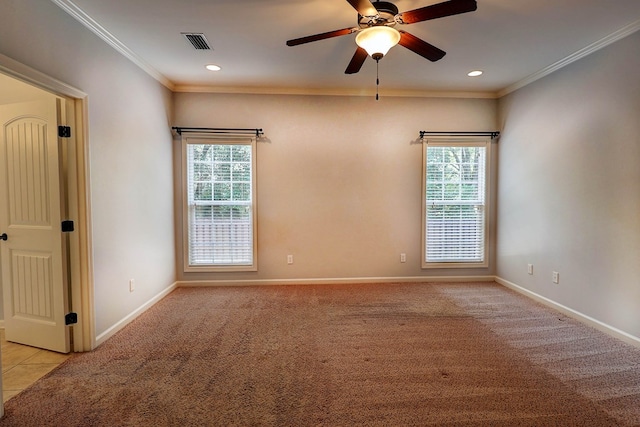 223 Veritas Dr, Dothan, AL 36303 - empty room featuring healthy amount of natural light, ornamental molding, ceiling fan, light colored carpet, and recessed lighting