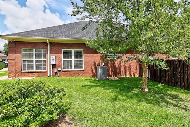 223 Veritas Dr, Dothan, AL 36303 - back of house with a shingled roof and brick siding
