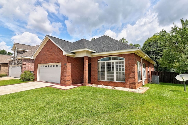 223 Veritas Dr, Dothan, AL 36303 - single story home featuring an attached garage, a shingled roof, driveway, and brick siding