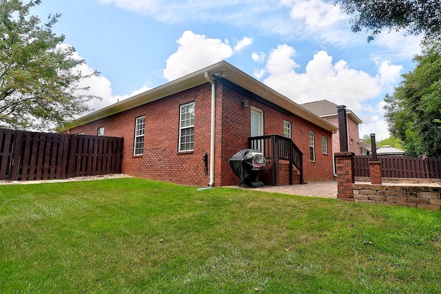 223 Veritas Dr, Dothan, AL 36303 - view of property exterior with brick siding and a patio area