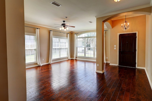223 Veritas Dr, Dothan, AL 36303 - entryway featuring arched walkways, ornamental molding, a chandelier, ceiling fan, and healthy amount of natural light