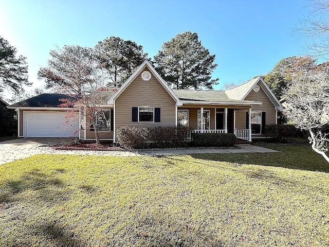 view of front of property featuring a porch, a garage, and a front lawn