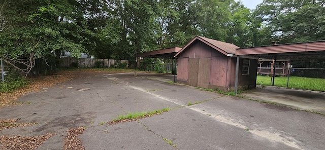 1594 Denton Rd, Dothan, AL 36303 - view of shed with driveway and a carport