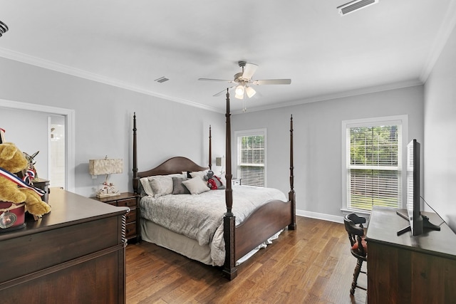 606 Billings Trl, Dothan, AL 36305 - bedroom with dark wood-style flooring, crown molding, ceiling fan, baseboards, and ensuite bathroom