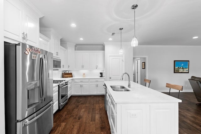 606 Billings Trl, Dothan, AL 36305 - kitchen with appliances with stainless steel finishes, a sink, light countertops, white cabinets, and dark wood-style flooring