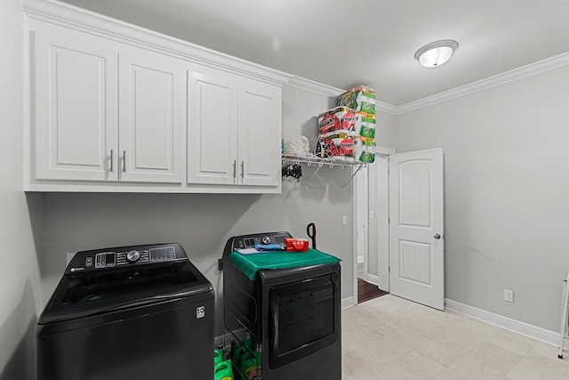 606 Billings Trl, Dothan, AL 36305 - laundry area with washing machine and dryer, crown molding, baseboards, and cabinet space