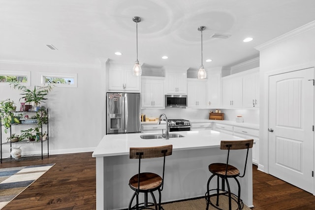 606 Billings Trl, Dothan, AL 36305 - kitchen with stainless steel appliances, a sink, crown molding, a kitchen bar, and white cabinets