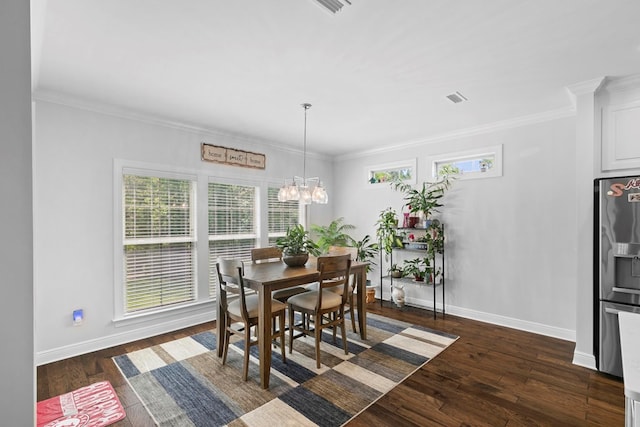 606 Billings Trl, Dothan, AL 36305 - dining area with dark wood-type flooring, baseboards, ornamental molding, and a chandelier