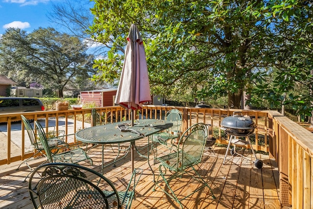 wooden deck featuring area for grilling