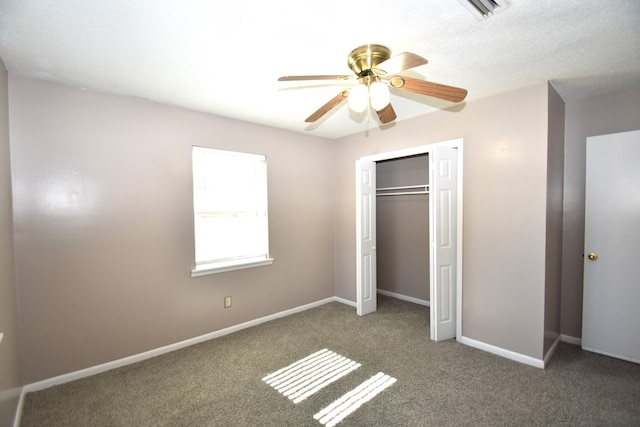 unfurnished bedroom featuring ceiling fan, carpet flooring, and a closet