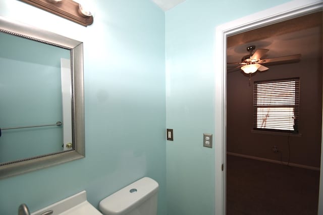 bathroom with ceiling fan and toilet