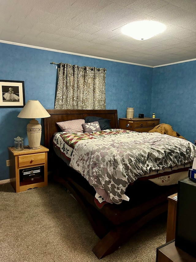 carpeted bedroom with ornamental molding and a textured ceiling