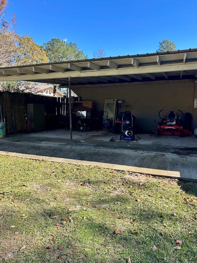 view of vehicle parking featuring a carport