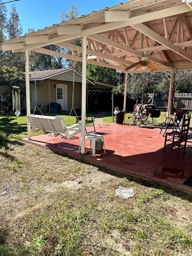 exterior space featuring ceiling fan and a patio