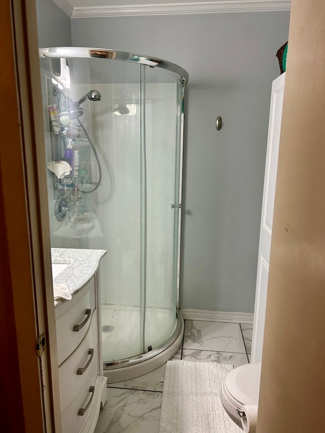 bathroom featuring vanity, ornamental molding, and walk in shower