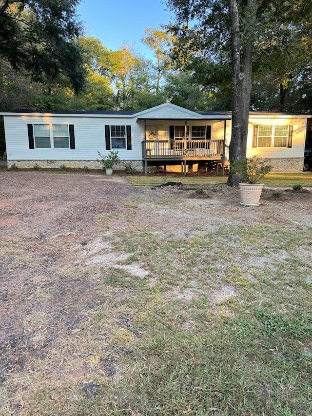 back of house with a wooden deck