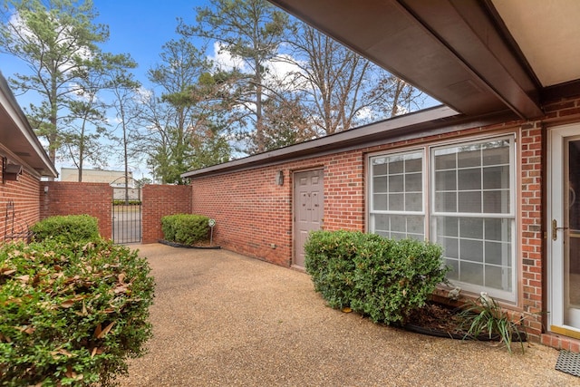 view of side of home with a patio area