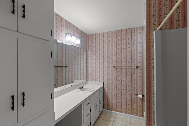 bathroom with tile patterned flooring and vanity