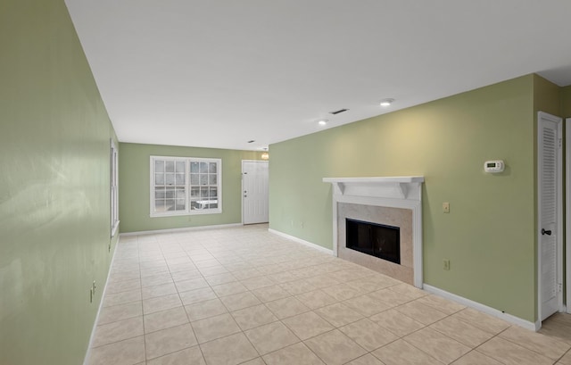 unfurnished living room featuring light tile patterned floors